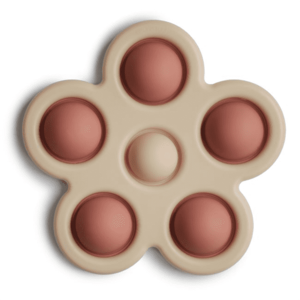 Zabawka sensoryczna Mushie Press Toy – Kwiatek Rose/Blush/Shifting Sand